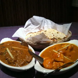 Lamb dish and chicken dish with some naan bread