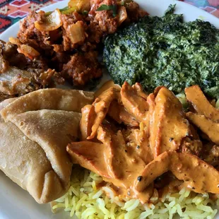 All available on the buffet! Clockwise from the top: Chili Chicken, Saag, Butter Chicken on rice, Samosa, Onion Bhaji.