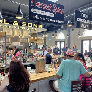 customers sitting at the bar