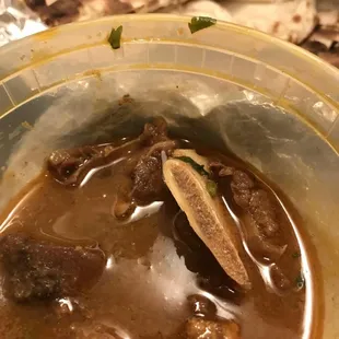 Curry Goat (too watery but good flavor) with complimentary rice and order of naan.  Ordered from Doordash. Curry Goat was $14.99