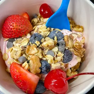 a bowl of fruit and granola
