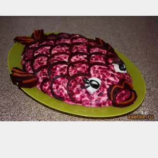 a pink fish on a green plate