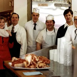 a group of people in a kitchen