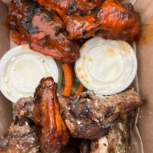 Garlic Parmesan and Saucey Rossi wings with ranch dressing