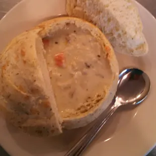 a bowl of soup and bread