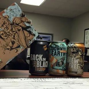 a glass of beer and a can of beer