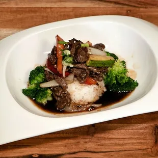 a plate of food on a wooden table
