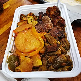 a meal in a styrofoam container