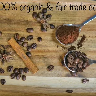 coffee beans and cinnamon on a wooden tray