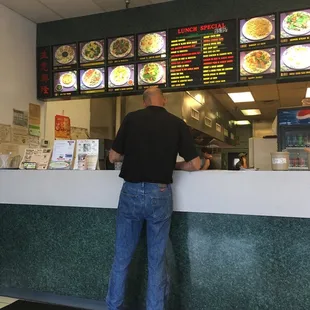 a man standing at the counter