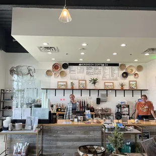 two people standing at the counter