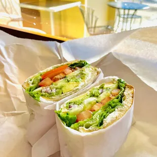two wraps of lettuce, tomato, and lettuce
