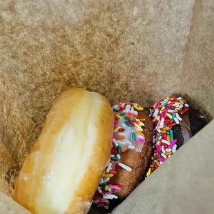 a half eaten donut with sprinkles