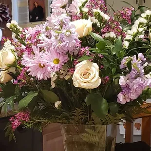 Very nice mixture of flowers  and roses .