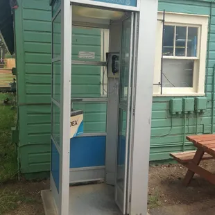Yes, you saw that right. It is a PHONE BOOTH. Fully operational. How fun!