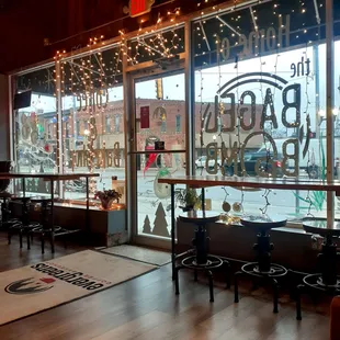 Storefront entrance. High top seats 6. Street and lot parking in back.