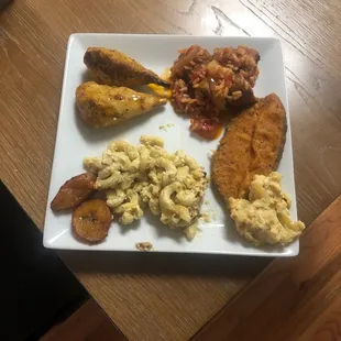 Lemon wings, sausage, fish pattie, cauliflower, Mac and cheese and plantains