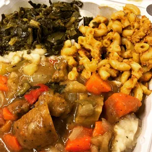 Pot roast over mashed potatoes, cashew Mac, greens