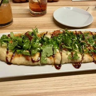 Prosciutto &amp; Arugula Flatbread with a balsamic glaze