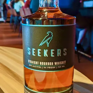 Seekers straight bourbon whiskey. An exceptional four grain. Take a bottle home with you.