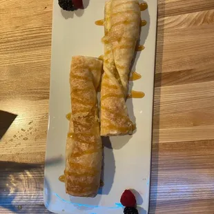 Kiedrowski's world famous Snoogle with Everwild's house Bourbon Caramel drizzle and fresh fruit.