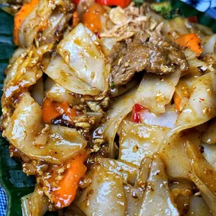 a plate of food with meat and vegetables