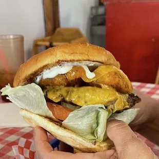 Jalapeño bomber burger.. has meat, cheese, jalapeño poppers, lettuce, tomato pickles and mayonnaise and mustard. It was awesome