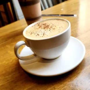 Eggnog latte on a clean, spacious table