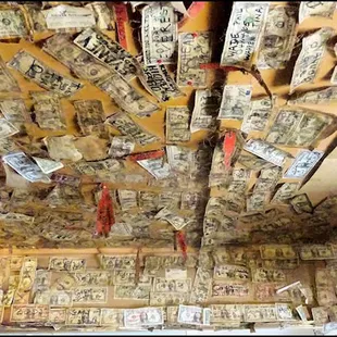 a ceiling covered in money notes