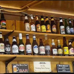 a shelf full of beer bottles