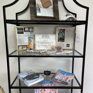 a shelf with books and magazines
