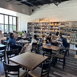 Dining area and array of bottled wine.