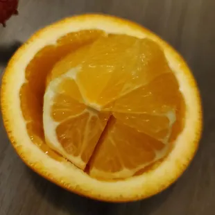 a half of an orange on a table