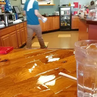 Sitting at the bar. Lots of seats are surrounding the bar. This place is larger than it looks from the outside!