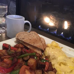 Veggie hash, scrambled eggs with white cheddar, rye toast.  Grab a spot by the fireplace on a cold morning!