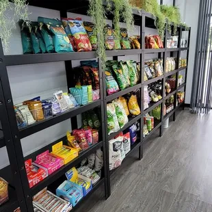 a woman standing in front of a grocery store