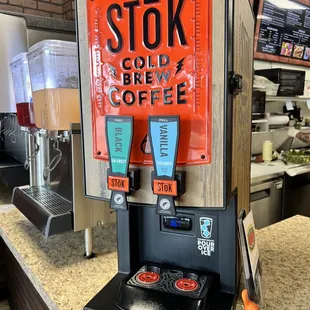 a drink dispenser on a counter