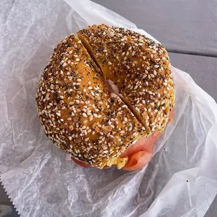 Everything egg bagel with plain cream cheese, lox, capers, tomato, and onion