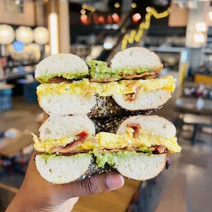 Egg and cheese bagel sandwich with bacon and avocado added