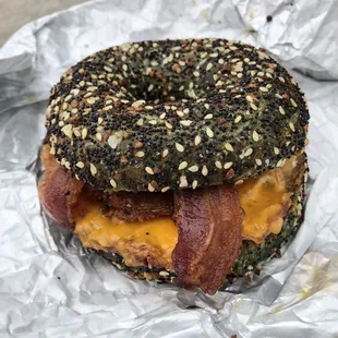 Build your own bagel with egg, cheese,bacon and fried green tomato on a seaweed everything bagel