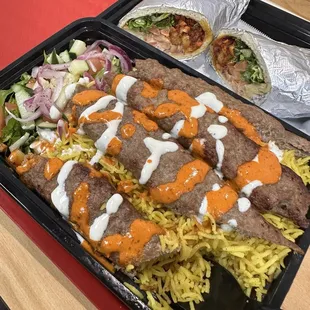 Lamb kebab over rice