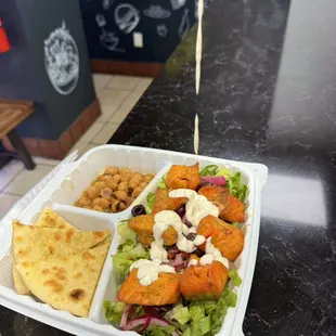 Salmon kebab over rice