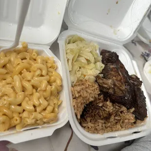 Jerk chicken, rice &amp; peas, cabbage, and mac &amp; cheese.