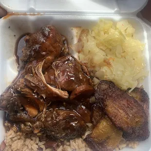 Brown stew chicken rice and peas cabbage with a side of plantains (free soda or water included)