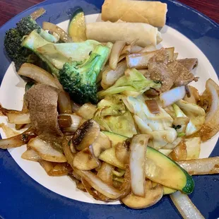 Vegetables and meat cooked on the grill.