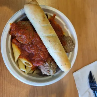 Penne pasta with meatballs and marinara sauce