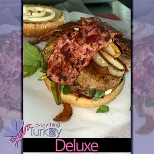 a burger with bacon and lettuce