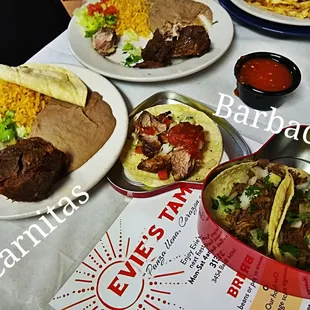 a table full of tacos and other food items