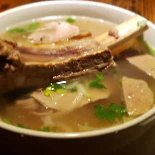The beef Pho topped with a beef rib