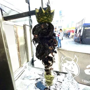 a bunch of broccoli on a stick